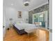 Stylishly decorated bedroom with modern decor, hardwood floors, and access to the deck at 1060 Mcdaniel Sw St, Atlanta, GA 30310