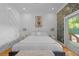 Stylishly decorated bedroom with modern decor, hardwood floors, and access to the deck at 1060 Mcdaniel Sw St, Atlanta, GA 30310