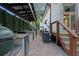 Outdoor kitchen and dining area with built in grill and brick pavers at 1060 Mcdaniel Sw St, Atlanta, GA 30310
