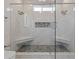 This luxurious walk-in shower features double shower heads and stone mosaic flooring and seating at 1060 Mcdaniel Sw St, Atlanta, GA 30310