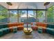Sunroom boasting floor-to-ceiling windows, natural light, and unique decor at 1060 Mcdaniel Sw St, Atlanta, GA 30310