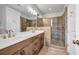 This bathroom features a double sink vanity and tiled walk-in shower with a glass door at 267 Castleberry Station Sw Dr, Atlanta, GA 30313