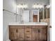 Modern bathroom with double sink vanity with a large mirror and decorative lighting at 267 Castleberry Station Sw Dr, Atlanta, GA 30313