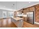 Well-equipped kitchen with stainless steel appliances, granite countertops, and a center island for meal preparation at 267 Castleberry Station Sw Dr, Atlanta, GA 30313