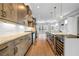 Open-concept kitchen with a granite island, a wine fridge, and modern appliances, offering a seamless cooking experience at 267 Castleberry Station Sw Dr, Atlanta, GA 30313