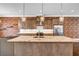 Modern kitchen with granite counters, center island, stainless steel appliances, and modern pendant lighting at 267 Castleberry Station Sw Dr, Atlanta, GA 30313