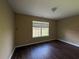 Bedroom featuring wood-look floors and a large window at 4302 Sorrells Dr, Powder Springs, GA 30127