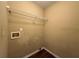 Small laundry room featuring a wire rack shelf and wood-look floors at 4302 Sorrells Dr, Powder Springs, GA 30127