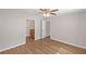 Large bedroom featuring wood-look floors and ensuite bathroom at 602 Abingdon Way, Atlanta, GA 30328
