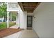 A ground-level view of the front door of a well-maintained, white condo unit at 602 Abingdon Way, Atlanta, GA 30328