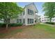 Exterior shot of a two-story condo with well-maintained landscaping at 602 Abingdon Way, Atlanta, GA 30328