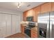 Updated kitchen features stainless steel appliances, granite countertops, and wood-look flooring at 602 Abingdon Way, Atlanta, GA 30328