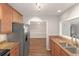 Updated eat-in kitchen features stainless steel appliances, granite countertops and an open concept at 602 Abingdon Way, Atlanta, GA 30328