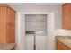 The updated kitchen also has a laundry nook with washer and dryer, and built-in cabinets at 602 Abingdon Way, Atlanta, GA 30328