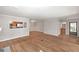 Spacious living room with wood floors, connecting to the kitchen and dining areas at 602 Abingdon Way, Atlanta, GA 30328