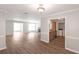 Bright and airy living room with wood-look flooring and open concept floor plan at 602 Abingdon Way, Atlanta, GA 30328