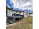 Backyard featuring a wooden deck, stairs, and an open space underneath for additional storage or landscaping at 2747 Santa Barbara Nw Dr, Atlanta, GA 30318