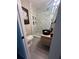 Modern bathroom with walk-in shower, marble-look tile, and black fixtures and vessel sink at 2747 Santa Barbara Nw Dr, Atlanta, GA 30318