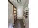 Hallway featuring unique sliding barn door, neutral paint, and a decorative painting to enhance the space at 2747 Santa Barbara Nw Dr, Atlanta, GA 30318