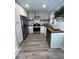 Well-lit kitchen featuring stainless steel appliances, wood countertops, and stylish shelving at 2747 Santa Barbara Nw Dr, Atlanta, GA 30318