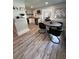 Modern kitchen and breakfast nook area with gray vinyl floors, and stainless steel appliances at 2747 Santa Barbara Nw Dr, Atlanta, GA 30318