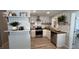 Bright kitchen showcasing white cabinets, butcher block counters, and open shelving at 2747 Santa Barbara Nw Dr, Atlanta, GA 30318