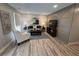 Comfortable living room with stylish furniture, a large TV, and a custom accent wall at 2747 Santa Barbara Nw Dr, Atlanta, GA 30318