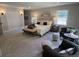 Spacious main bedroom with carpet, sitting area, and en-suite bath at 2747 Santa Barbara Nw Dr, Atlanta, GA 30318