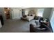 Spacious main bedroom with carpet, sitting area, and en-suite bath at 2747 Santa Barbara Nw Dr, Atlanta, GA 30318