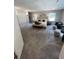 Spacious main bedroom with soft gray carpet, accent furnishings, and bright natural lighting at 2747 Santa Barbara Nw Dr, Atlanta, GA 30318