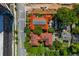 Aerial view of buildings with red tile roofs along a busy street lined with trees at 8 Collier Nw Rd # B2, Atlanta, GA 30309