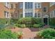 Charming brick courtyard with meticulous landscaping, providing a serene outdoor space surrounded by classic brick architecture at 8 Collier Nw Rd # B2, Atlanta, GA 30309