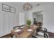 Well-lit dining room with hardwood floors and a minimalist aesthetic, perfect for Gathering meals or formal entertaining at 8 Collier Nw Rd # B2, Atlanta, GA 30309