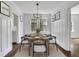 Elegant dining room featuring wainscoting, hardwood floors, and a modern chandelier creating a sophisticated ambiance at 8 Collier Nw Rd # B2, Atlanta, GA 30309