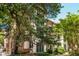 Beautiful brick building with mature trees creating a picturesque setting and classic architectural charm at 8 Collier Nw Rd # B2, Atlanta, GA 30309