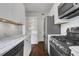 Renovated kitchen featuring stainless steel appliances, marble countertops, and ample storage space at 8 Collier Nw Rd # B2, Atlanta, GA 30309