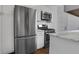 Bright kitchen featuring stainless steel appliances, white cabinets, and modern fixtures at 8 Collier Nw Rd # B2, Atlanta, GA 30309