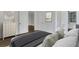 Comfortable main bedroom with a view of an adjoining room, a decorative dresser and contemporary artwork at 8 Collier Nw Rd # B2, Atlanta, GA 30309