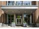 Elegant building entrance with modern design, planters, and clear signage for ViewPoint at 855 Peachtree Ne St # 1912, Atlanta, GA 30308