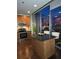 Modern kitchen with island seating, stainless appliances, and a vibrant city view at 855 Peachtree Ne St # 1912, Atlanta, GA 30308