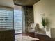 Inviting living room with contemporary decor and a view of the balcony at 855 Peachtree Ne St # 1912, Atlanta, GA 30308