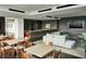 Relaxing lounge area with tables, chairs and a TV at 855 Peachtree Ne St # 1912, Atlanta, GA 30308
