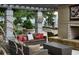 Outdoor seating area with a fireplace and comfortable seating at 855 Peachtree Ne St # 1912, Atlanta, GA 30308