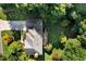 Aerial view of home with large roof and private backyard with patio and mature trees at 13 Sherman Nw Ln, Cartersville, GA 30121