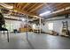 Large basement with exposed ceiling beams and walk-out access to the backyard at 13 Sherman Nw Ln, Cartersville, GA 30121