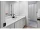 Clean bathroom featuring a white vanity, large mirror, and a shower with a white curtain at 13 Sherman Nw Ln, Cartersville, GA 30121