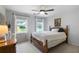 Comfortable bedroom with natural light from two windows and a ceiling fan for added comfort at 13 Sherman Nw Ln, Cartersville, GA 30121