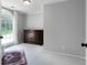 Bright bedroom with a dark wood dresser, large arched window, and a patterned rug at 13 Sherman Nw Ln, Cartersville, GA 30121
