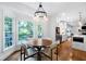 Bright breakfast nook with large windows, natural light, and adjacent access to the kitchen at 13 Sherman Nw Ln, Cartersville, GA 30121