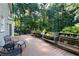 Outdoor deck complete with chairs, a bench, and various planters for a calming view of nature at 13 Sherman Nw Ln, Cartersville, GA 30121